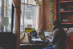 woman sitting behind desk at home