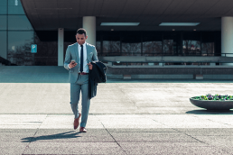 Man in suit texting